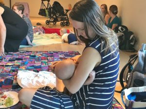 a photo of a breastfeeding mother at the Latch On event