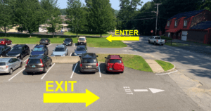 a photo of our parking lot with arrows pointing out which way to enter and exit the lot.